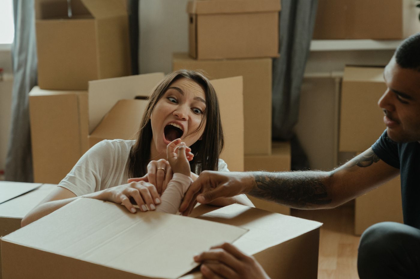 A woman unpacking boxes in her new home